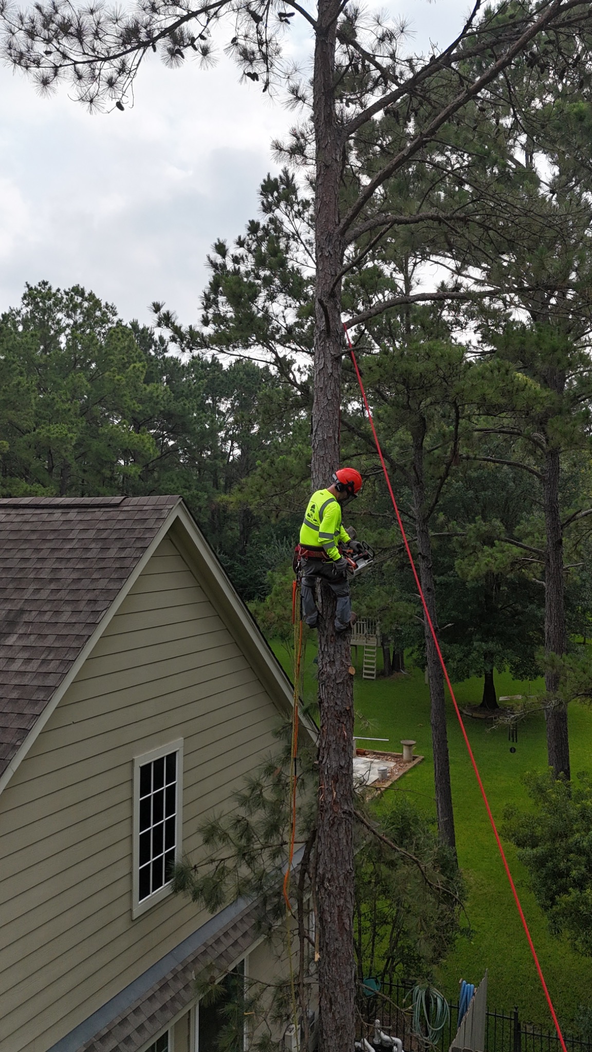 Climber working near a home